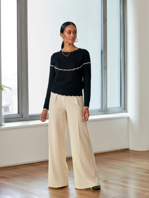 Jersey de punto con volante en el pecho