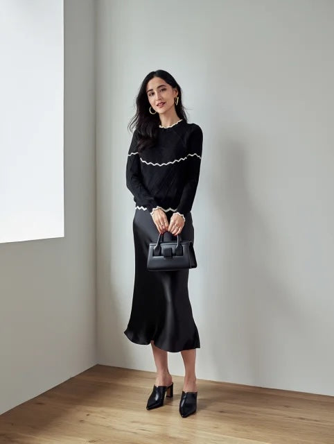 Jersey de punto con volante en el pecho