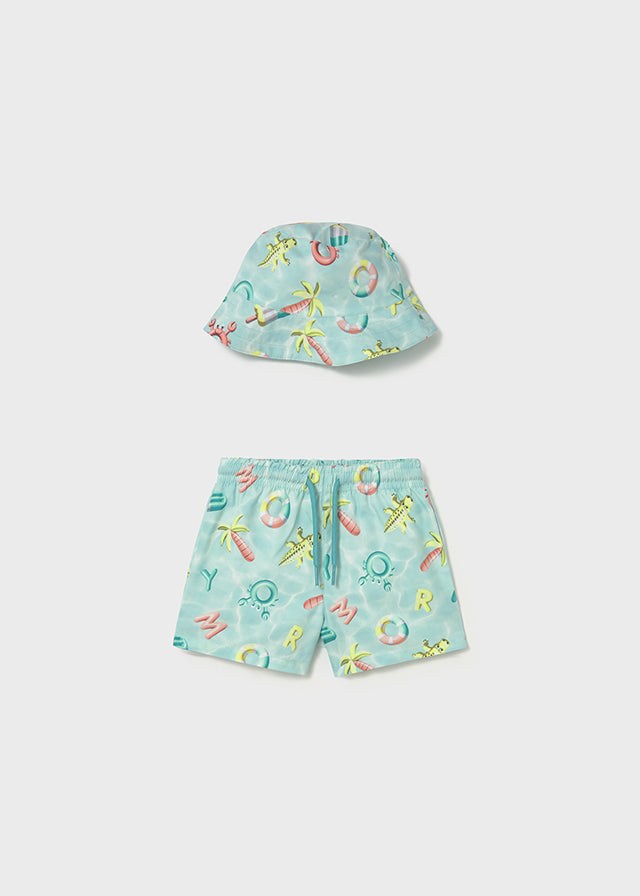 Conjunto de baño con gorro.