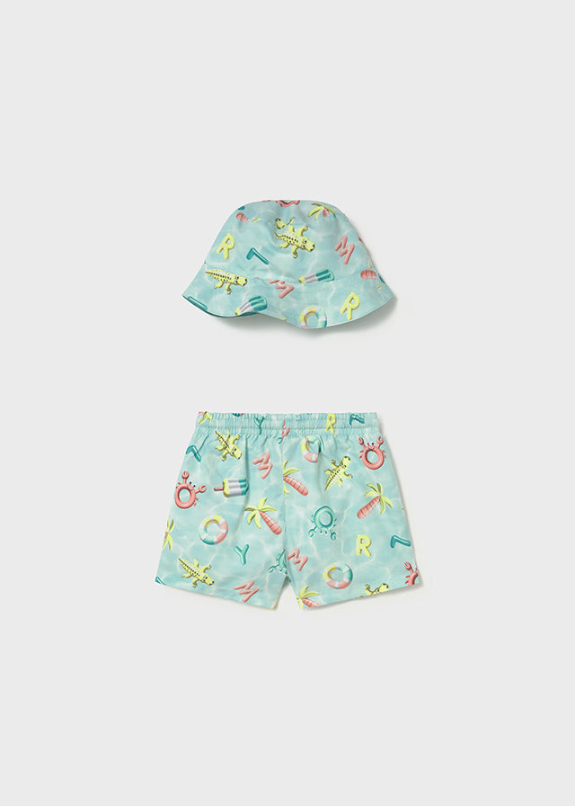 Conjunto de baño con gorro.