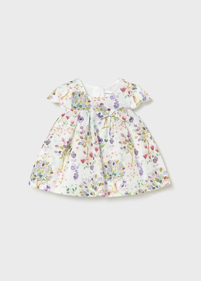 Vestido bebé estampado floral con lazo.