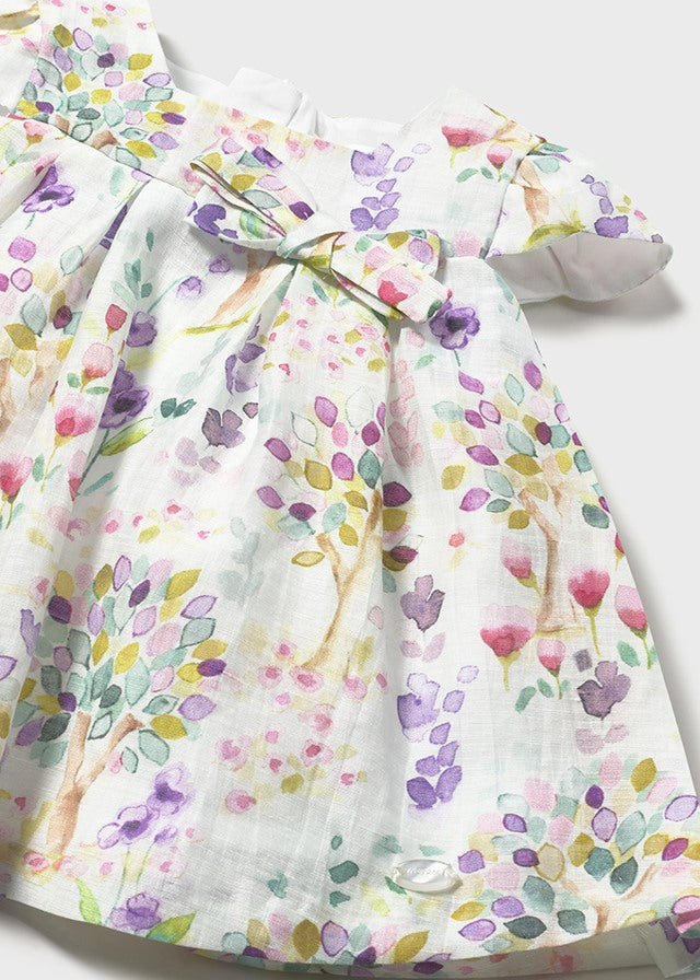 Vestido bebé estampado floral con lazo.