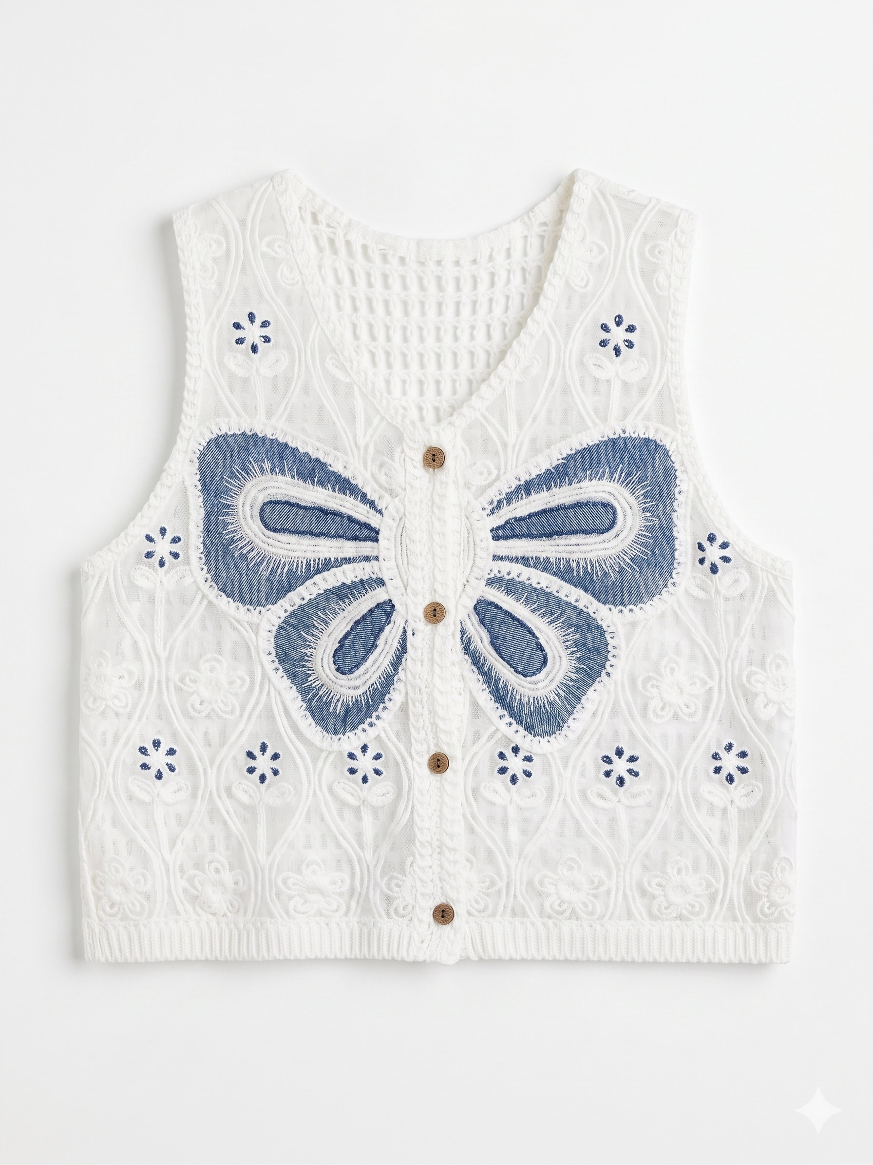 Chaleco de punto blanco calado con detalle de mariposa azul chica.