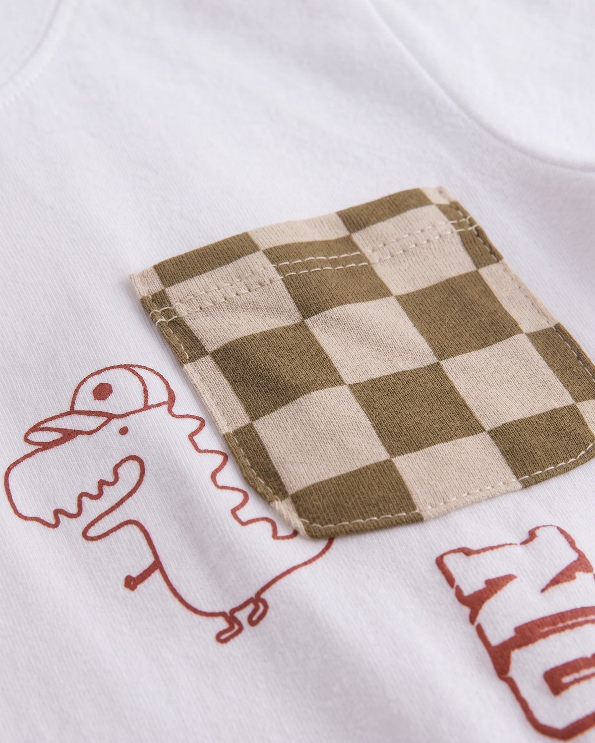 Camiseta dino con bolsillo bebé niño