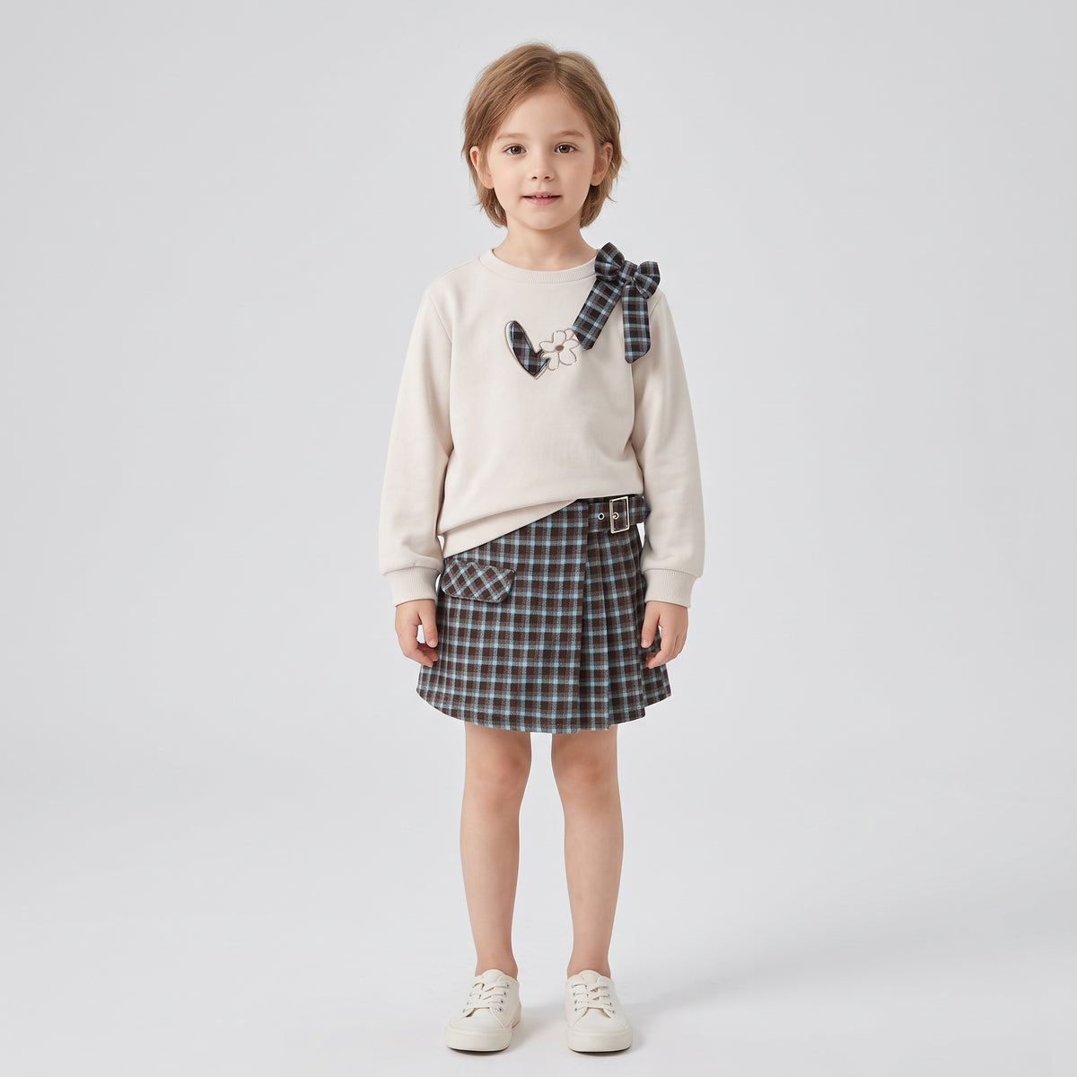 Falda short cuadros niña.