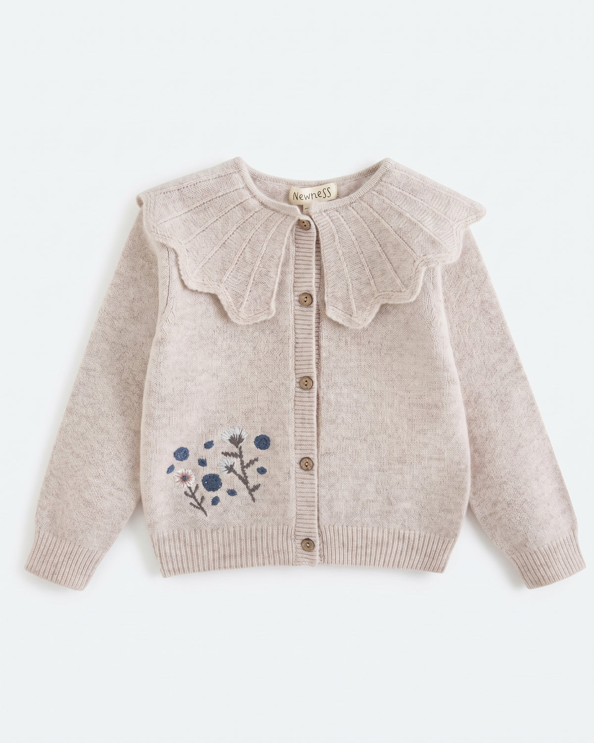 Chaqueta tricot cuello babero y flores bordadas niña
