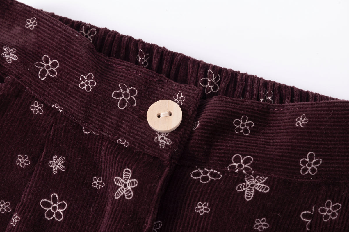 Pantalón corte recto y ancho micropana flores burdeos.