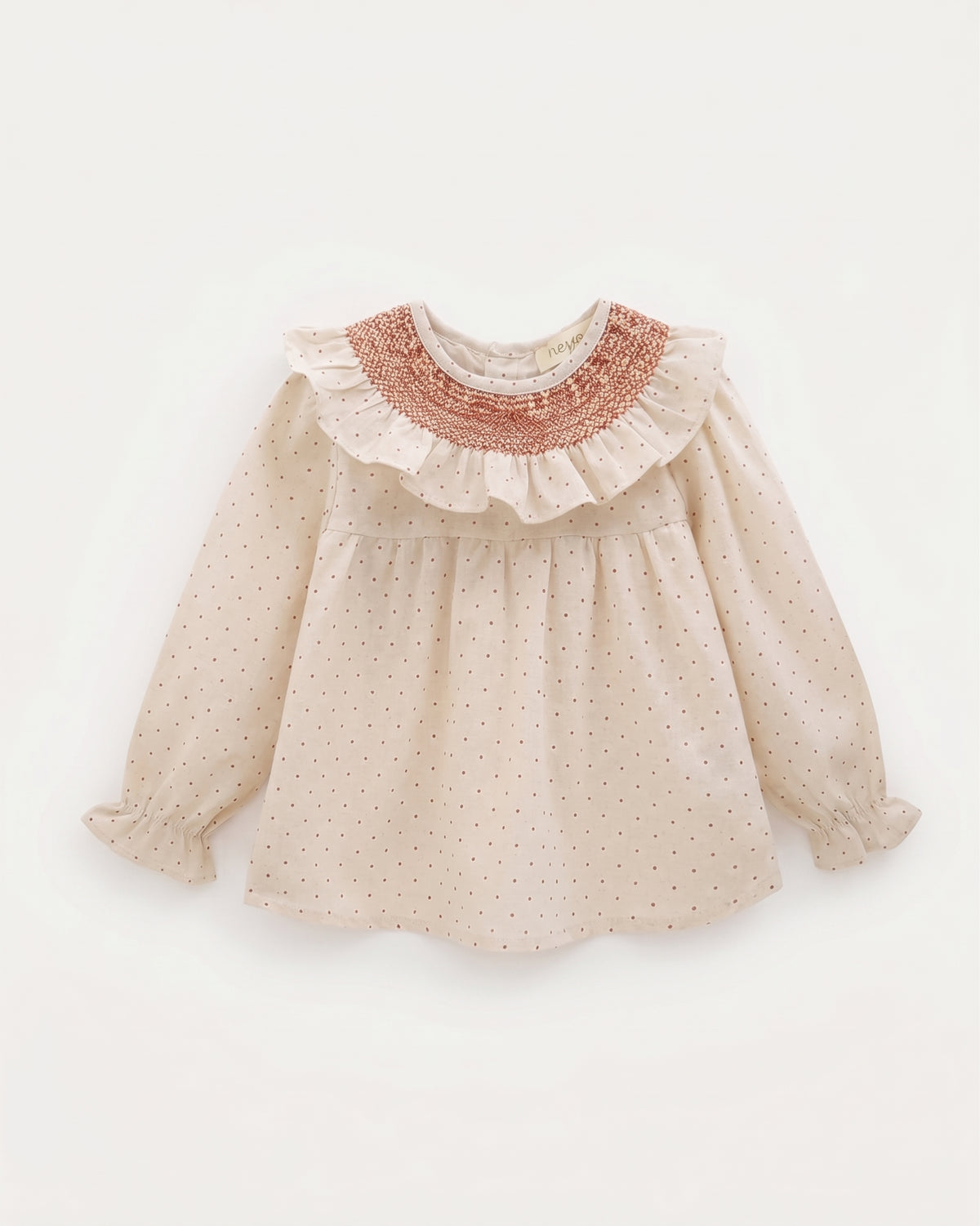 Blusa estampada manga larga cuello nido de abeja y volante bebé y niña.