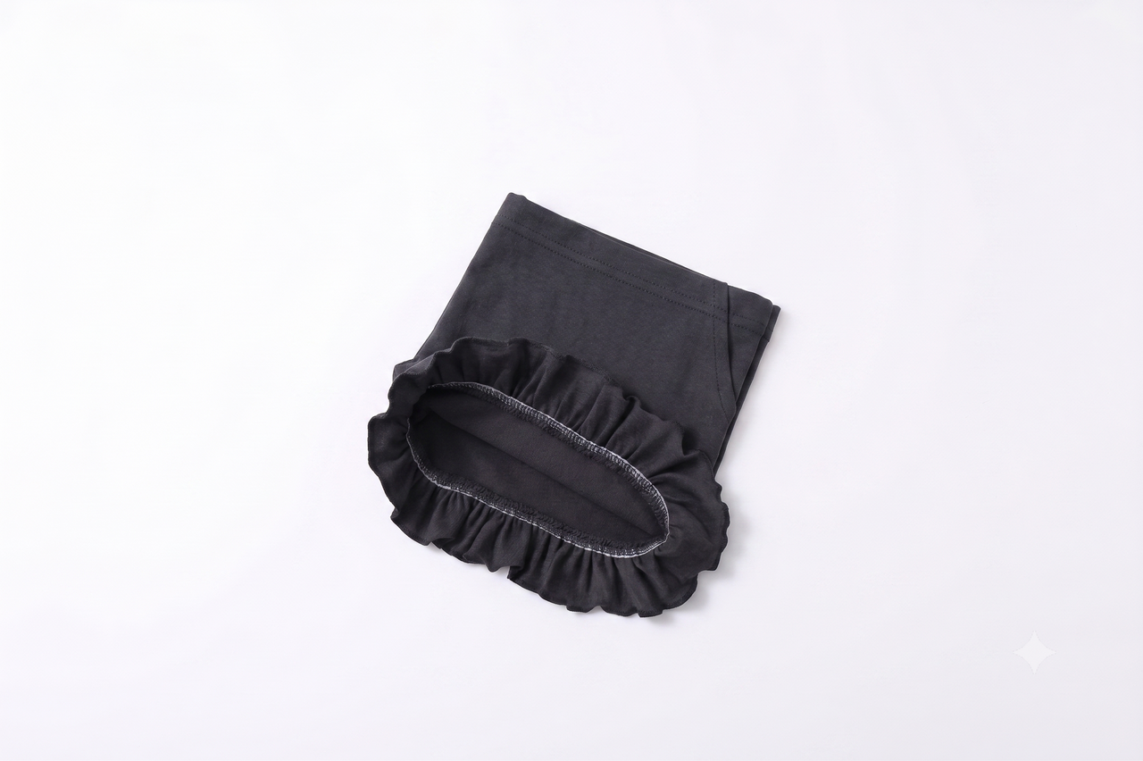 Pantalón corto de punto niña con volante.