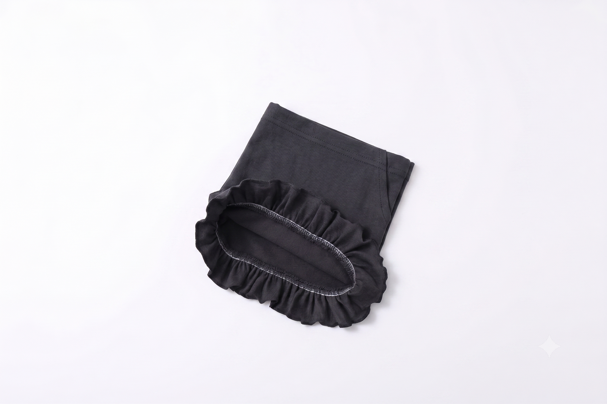 Pantalón corto de punto niña con volante.